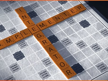 The words Implementer and Integrator crossing on a word board